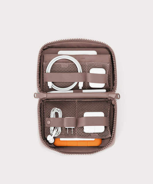 hover - Dagne Dover large Arlo Tech Organizer in pink unzipped, revealing the interior elastic loops and airmesh pockets.
