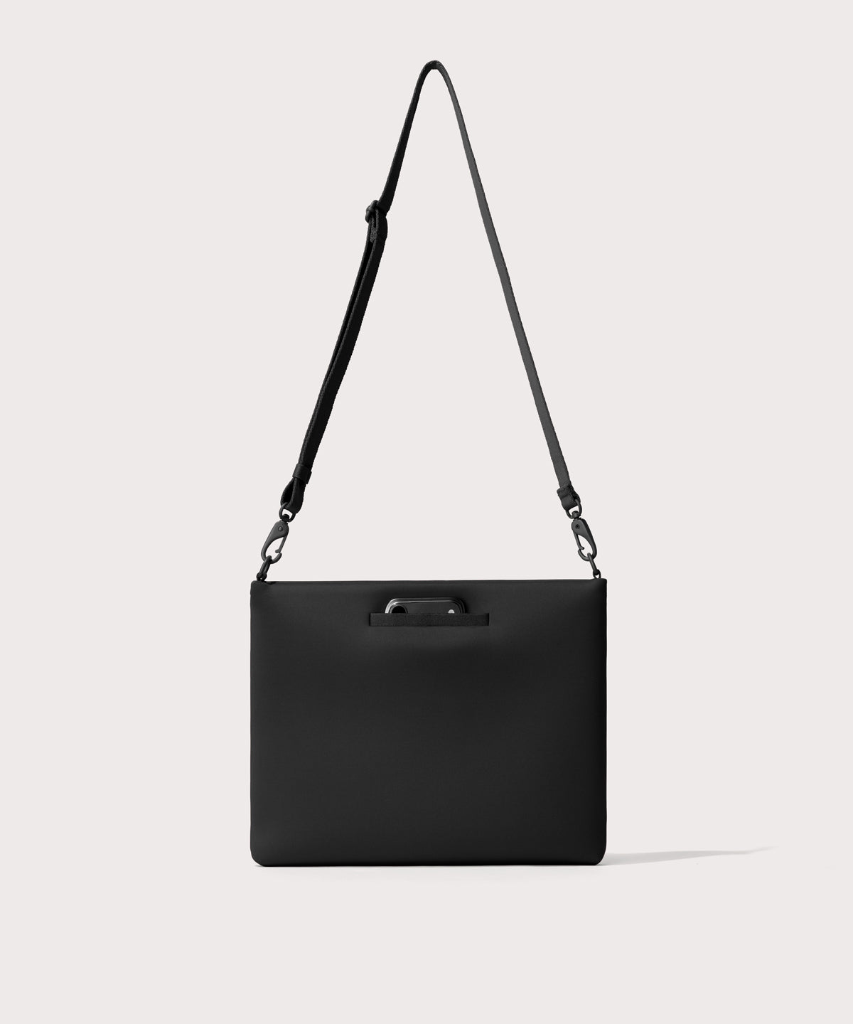 14 inch laptop shoulder bag in a black seen from the back view showing phone pocket.’