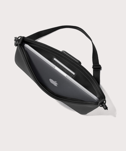 14 inch laptop shoulder bag in a black seen from the top down view showing interior.