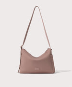 Shoulder bag in a pink seen from the front view.
