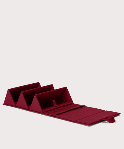 Dagne Dover Remi foldable glasses holder in spice red, unfolded.