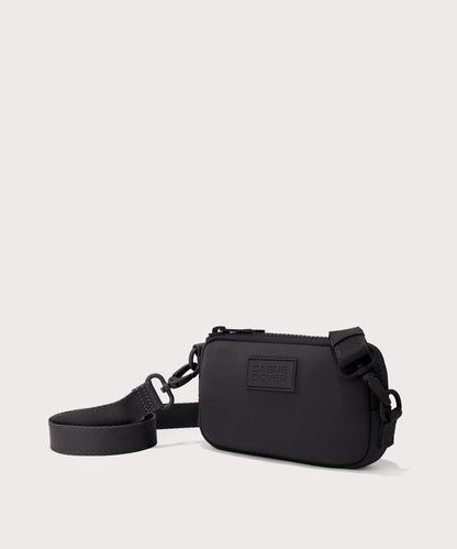 Dagne Dover Mara Phone Sling in black seen from an angle, showing the adjustable shoulder strap drop.