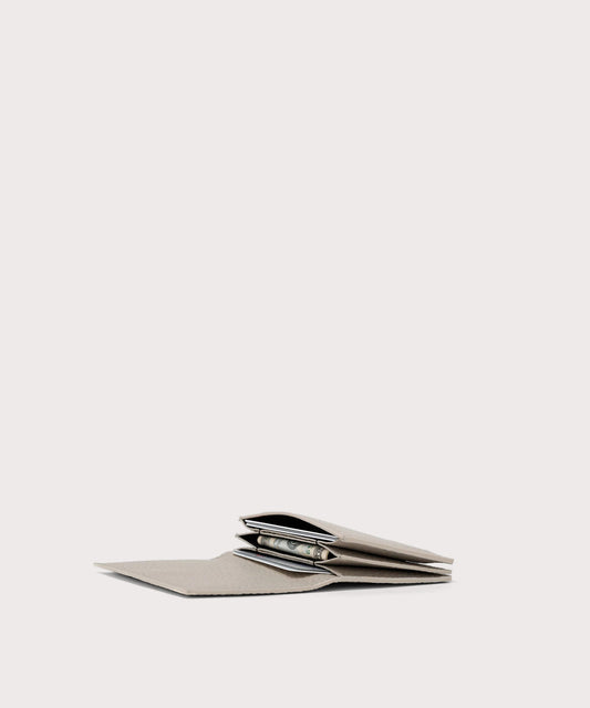 hover - Dagne Dover Accordion Card Case in white opened, revealing the three internal gusseted card slots.